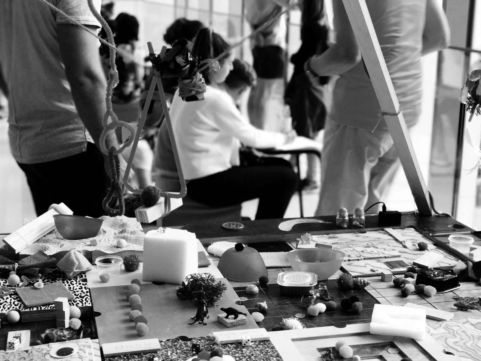 a group of people standing around a table. Photograph accompanying Velaharra’s cultural sponsorship guide.